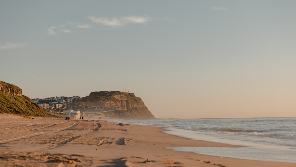 a beach with a few people