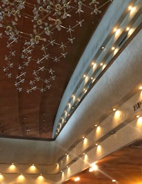 Modern interior showcasing elegant ceiling moldings and lighting.