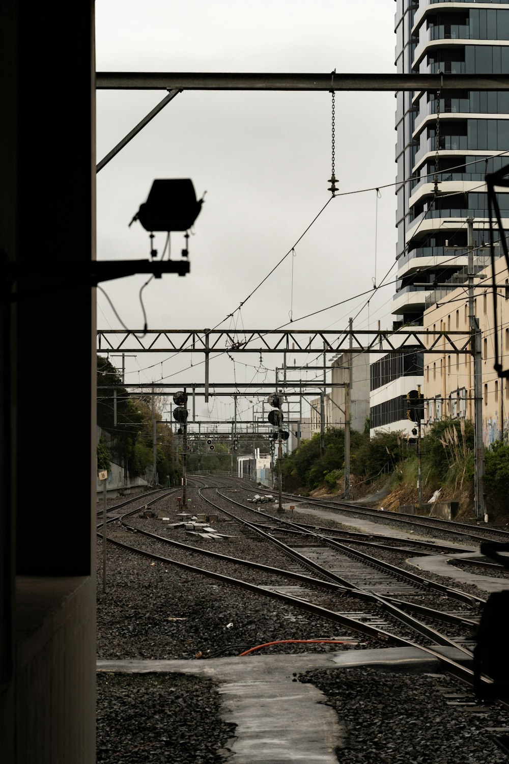 train tracks with buildings in the background