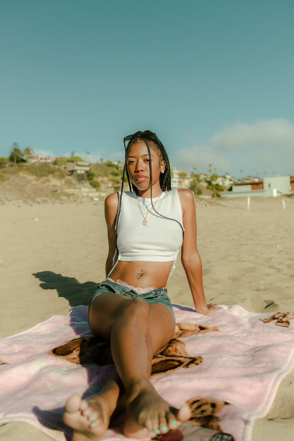 a woman sitting on a beach