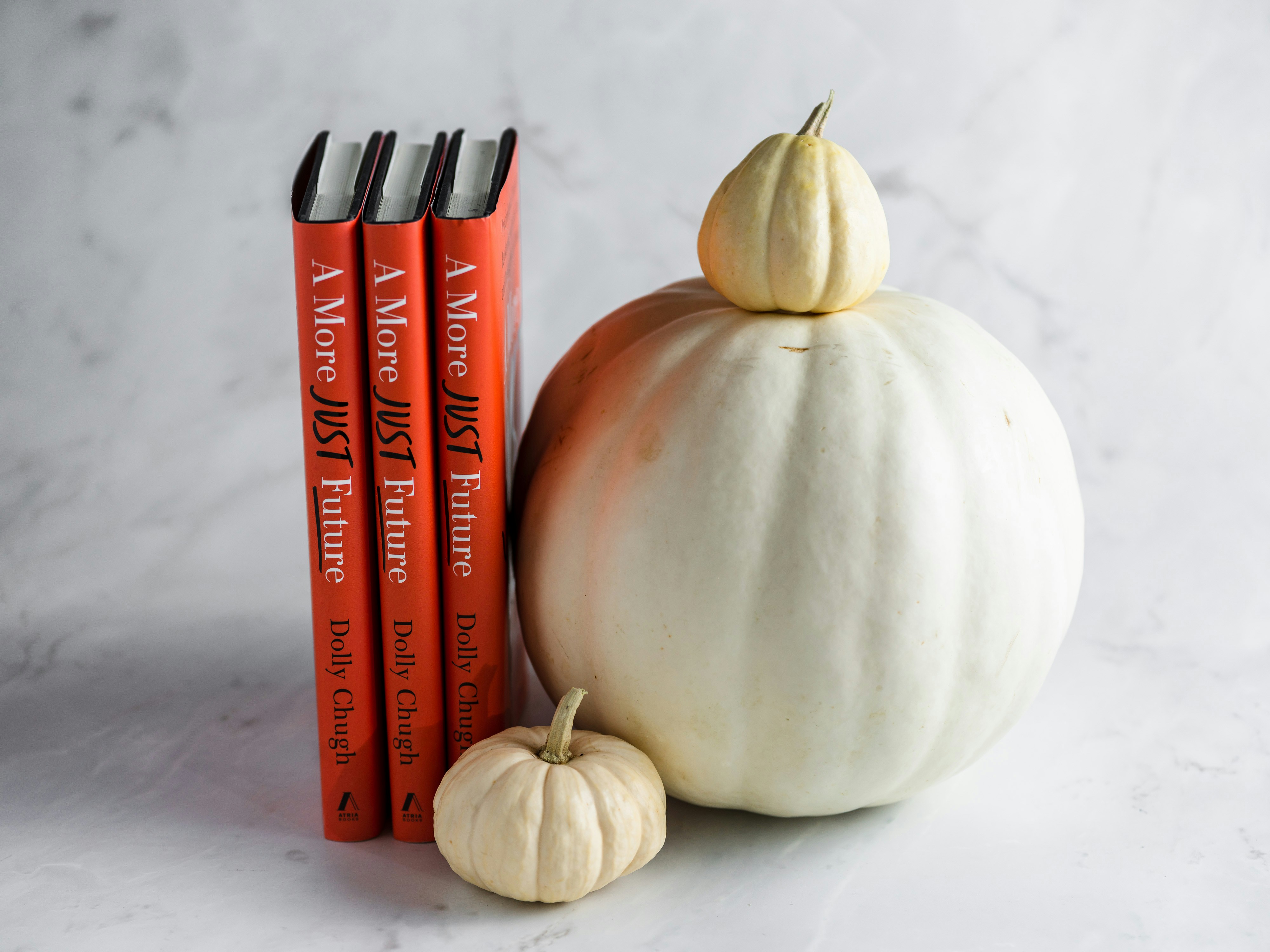 a white onion next to a red pepper and a white onion