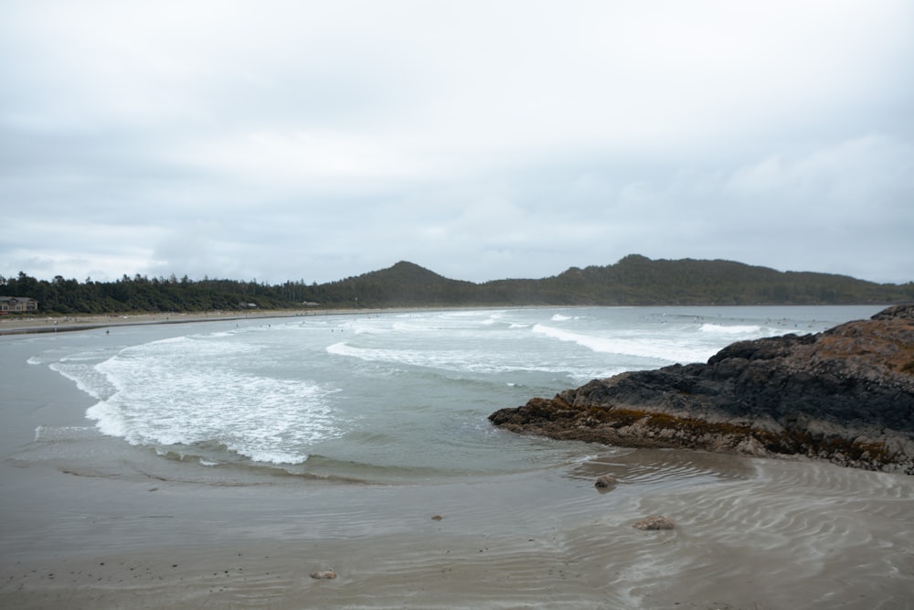 a beach with rocks and water