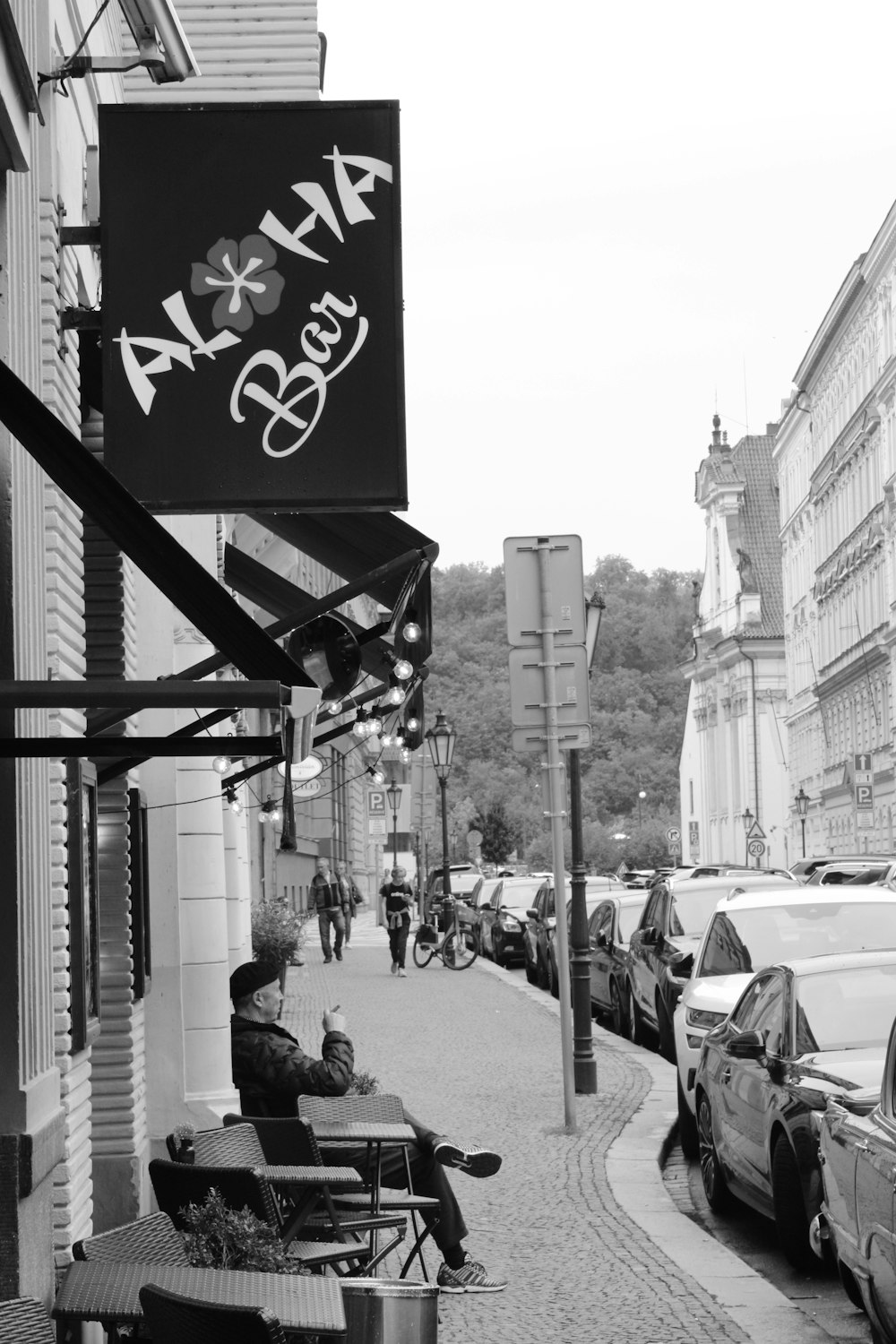 a street with cars and people