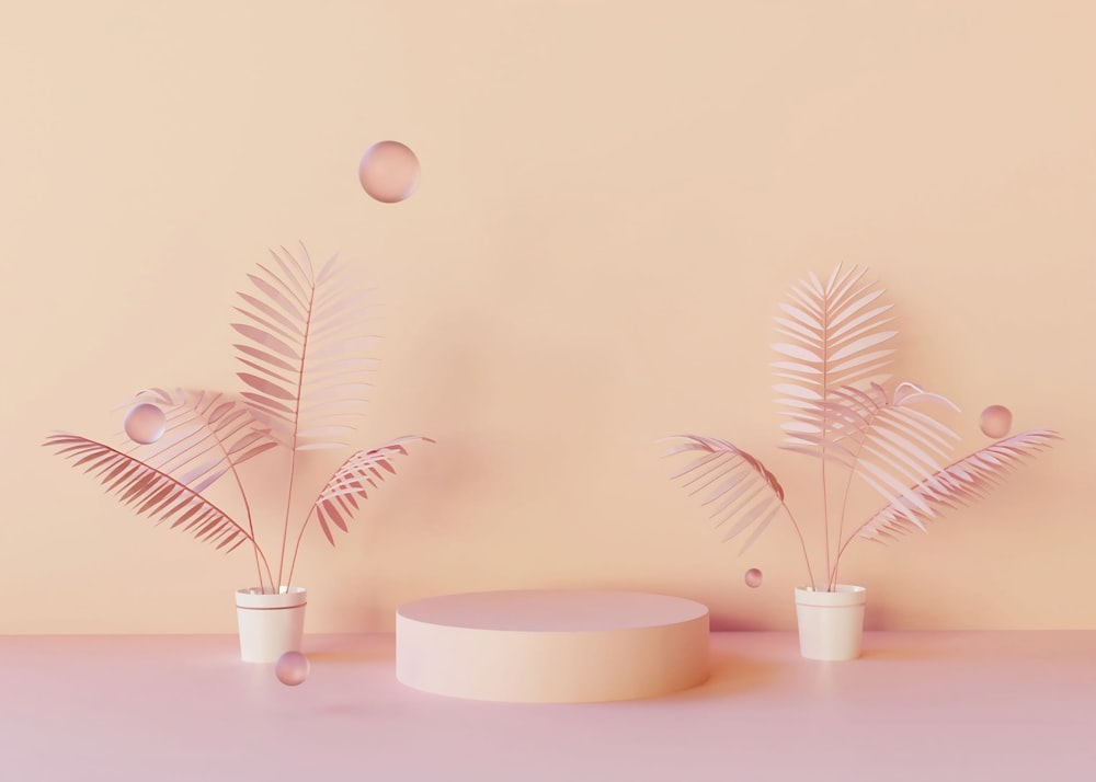 a group of small white bowls with pink flowers in them