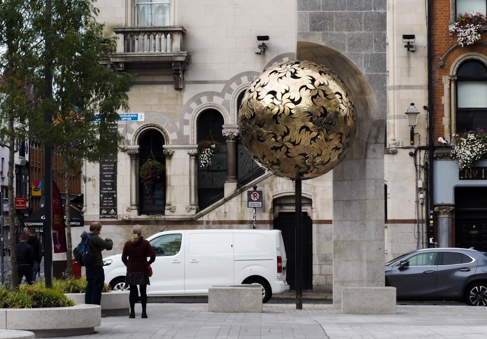 a large sculpture in front of a building