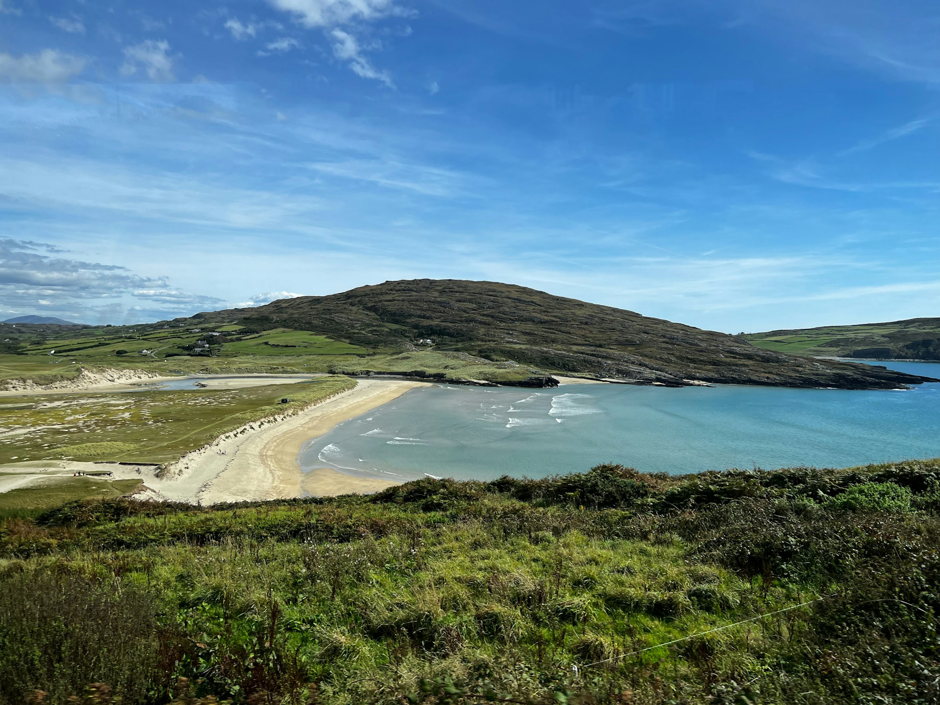 a beach with a body of water