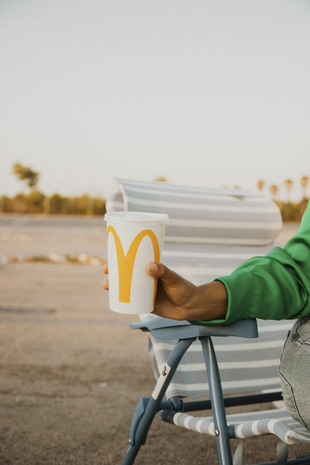 a person holding a cup