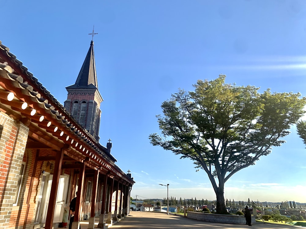 a church with a tree in front