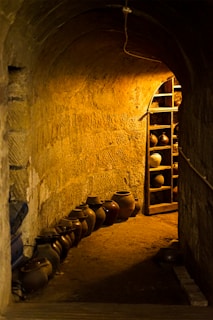 a room with a shelf and pots