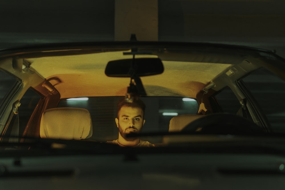 a person looking out of a car window