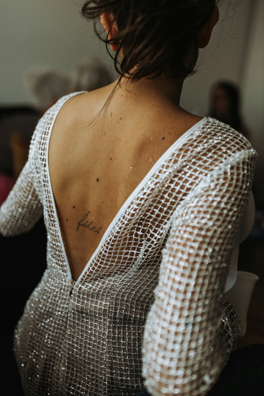 a woman with a tattoo on her back