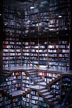 a room with shelves and books