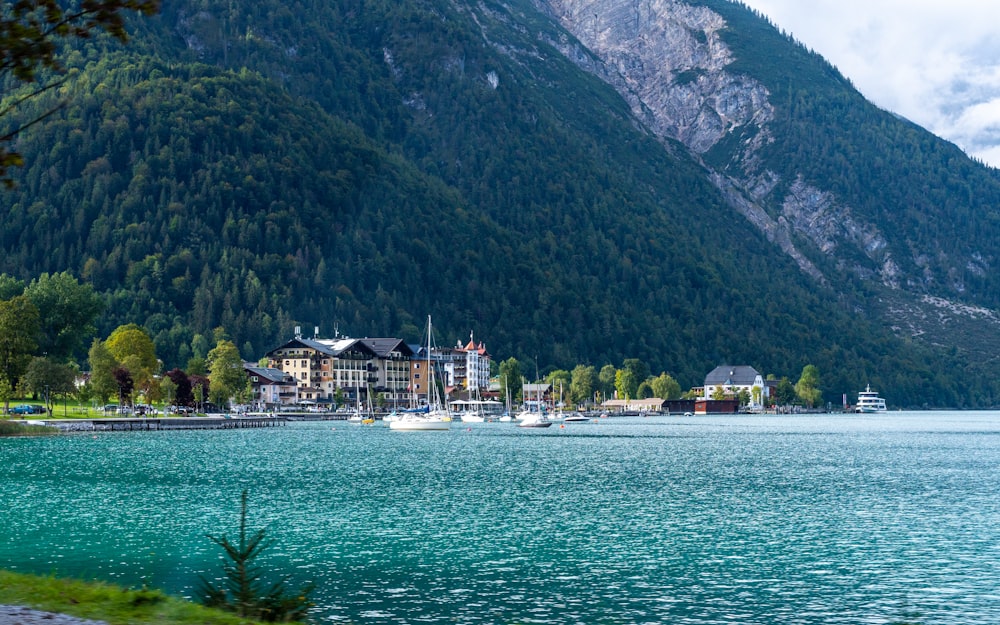 a body of water with boats and a building by it