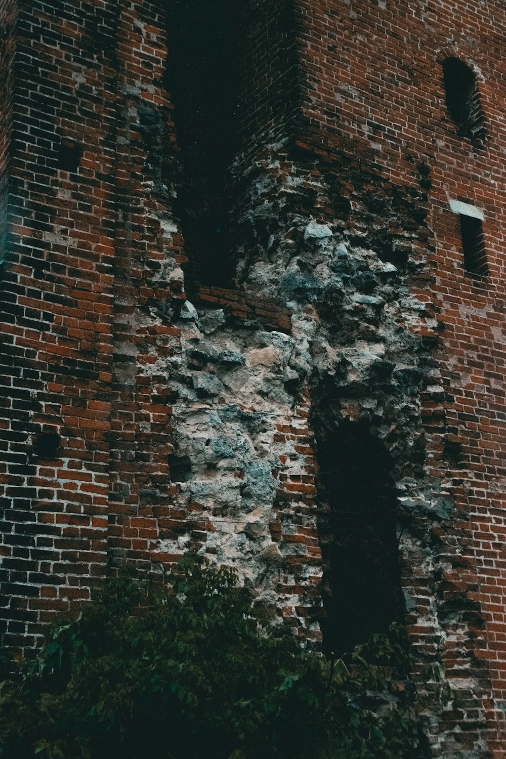 a brick wall with a hole in it