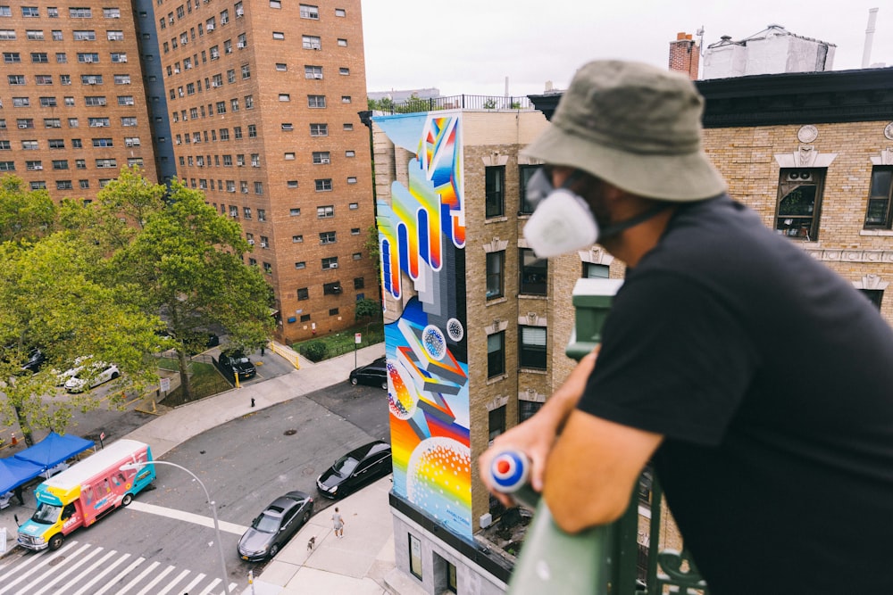 a man painting a building