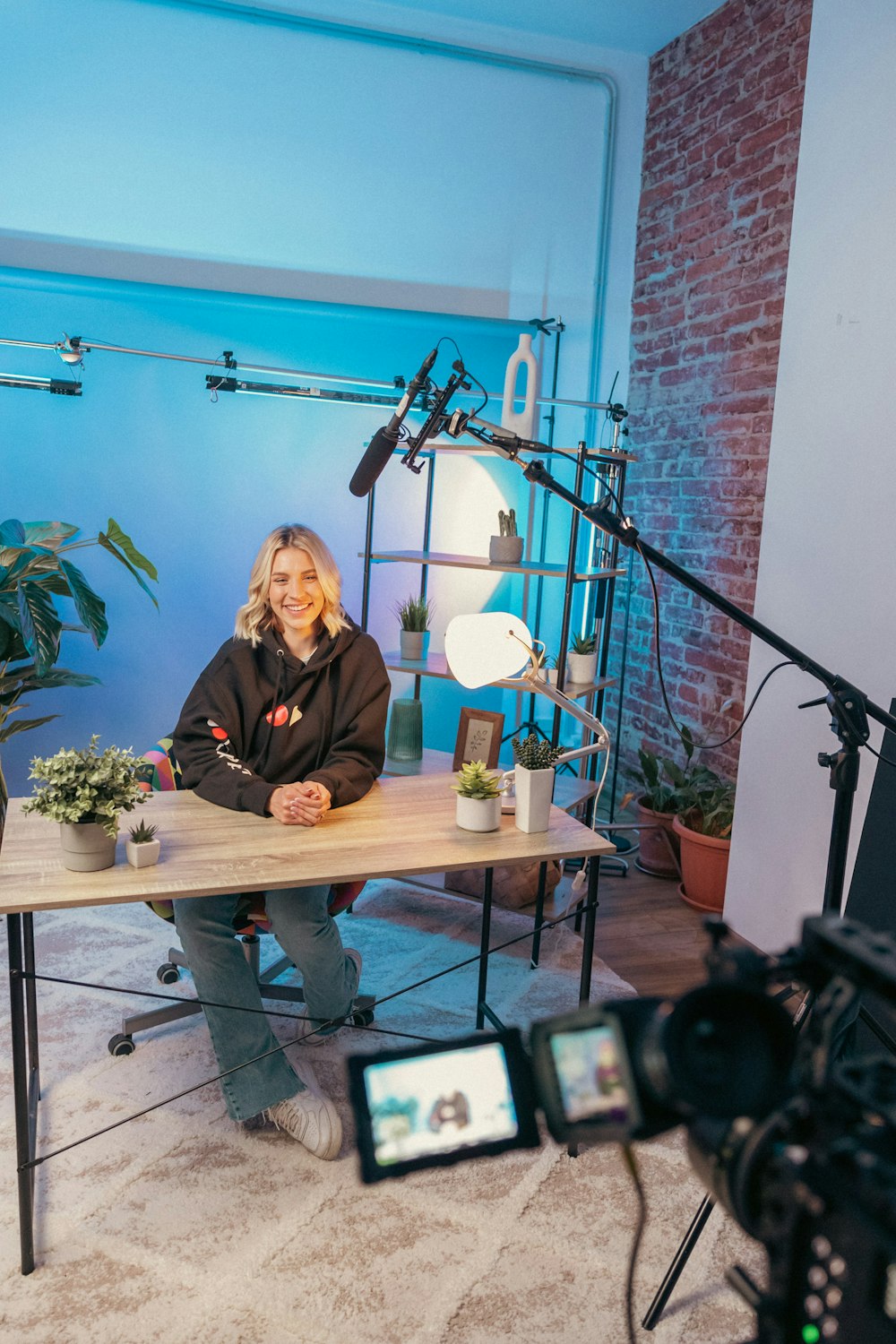 A woman sitting at a table with a microphone talking about how to fix a copyright claim on YouTube