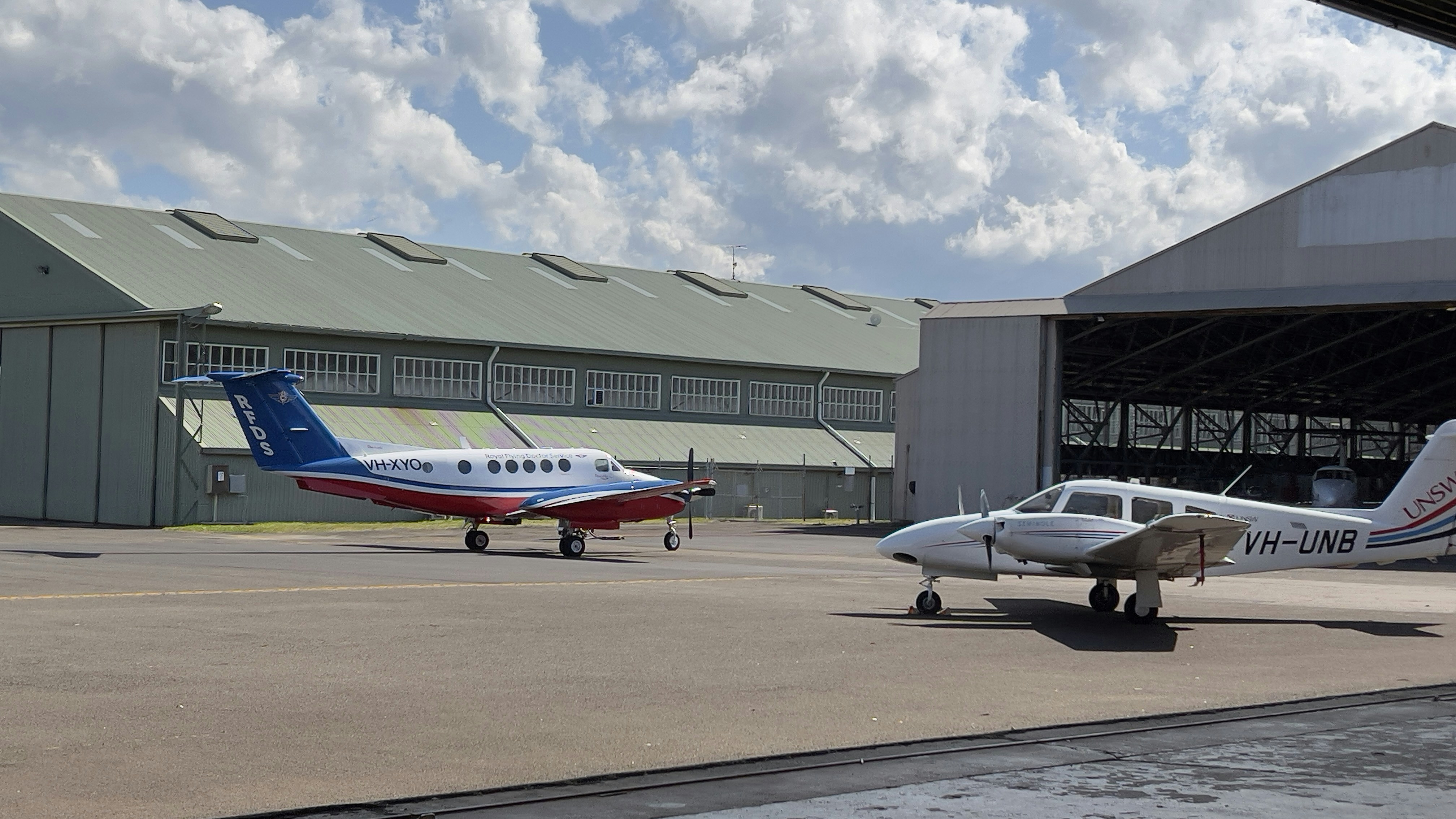 airplanes parked at airport, UNSW hangar at Bankstown Airport.
