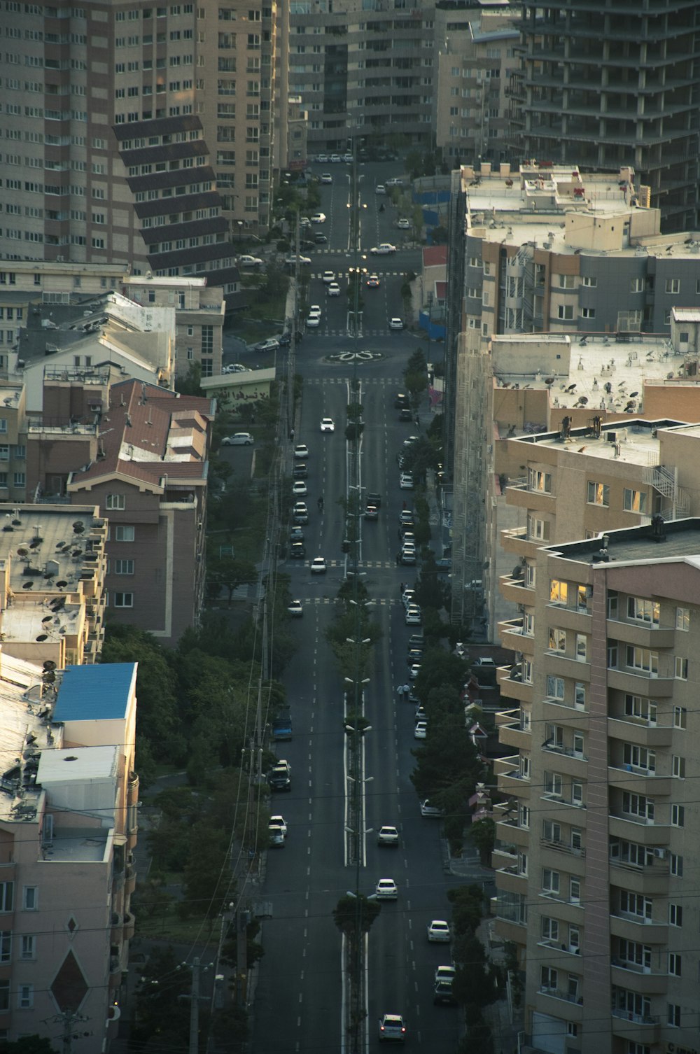 a city street with cars and buildings