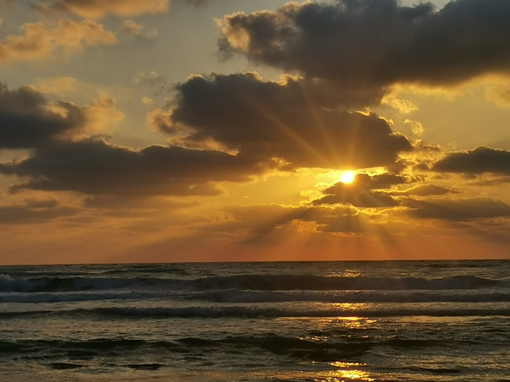 a sunset over the ocean