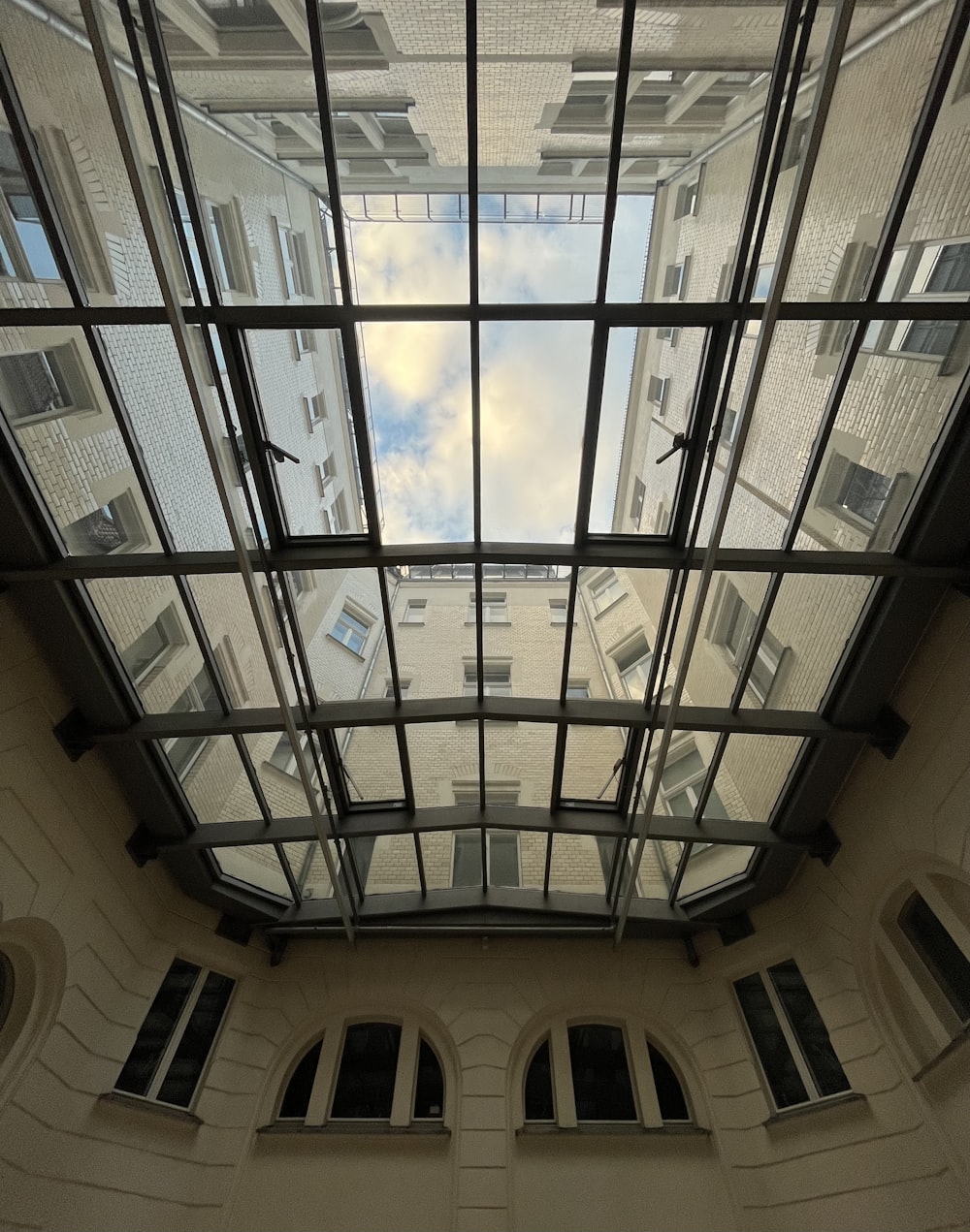 looking up at a building through a window