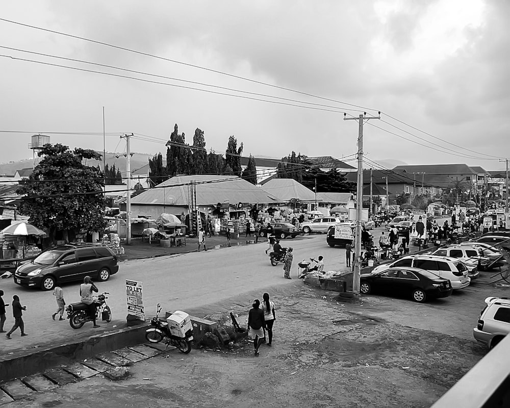 a street with cars and people