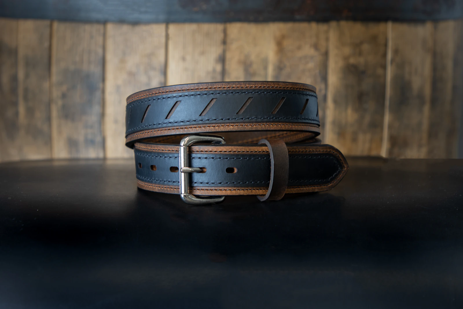 Black leather belt with steel buckle