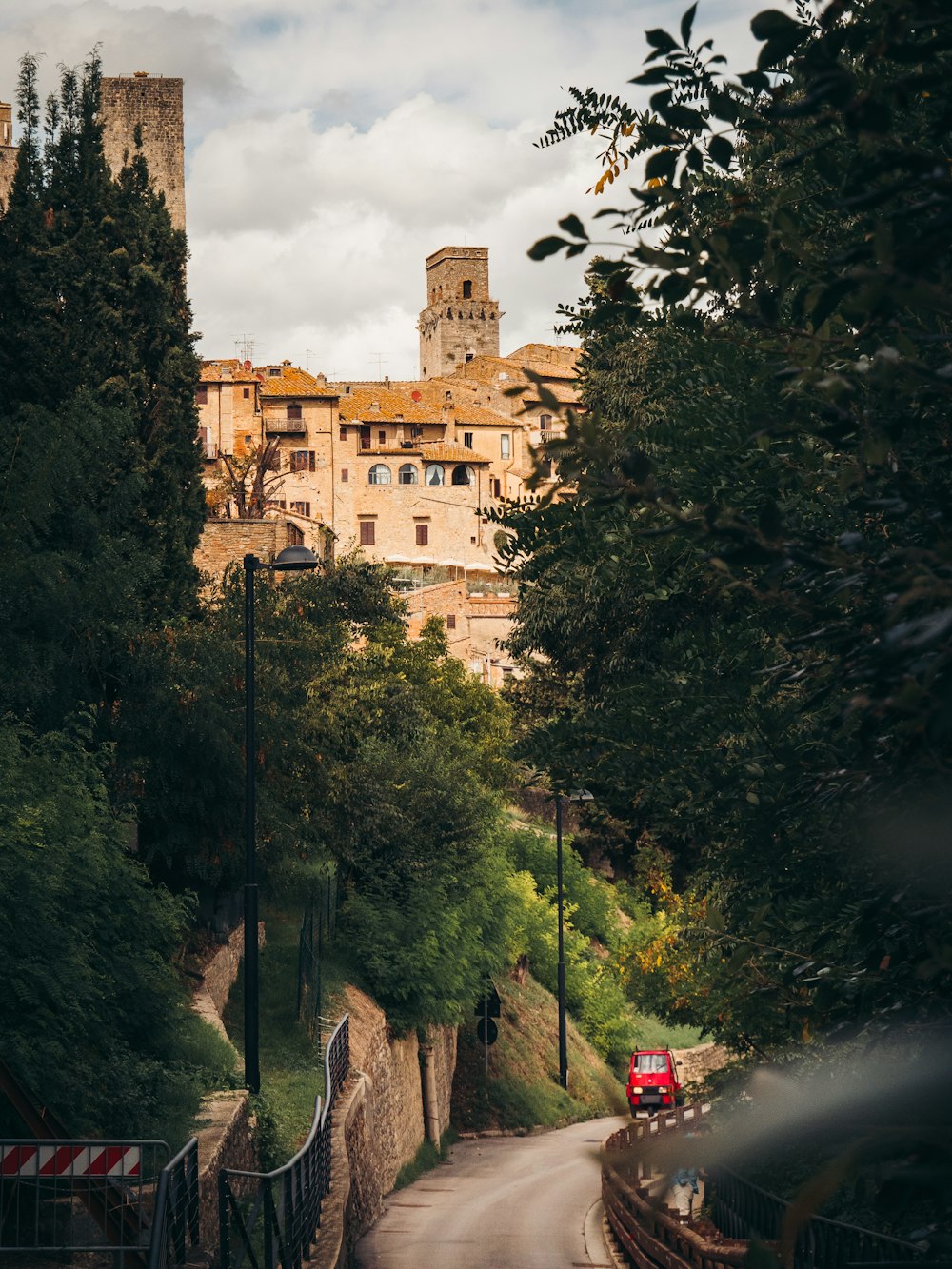 a road with trees and a building on the side