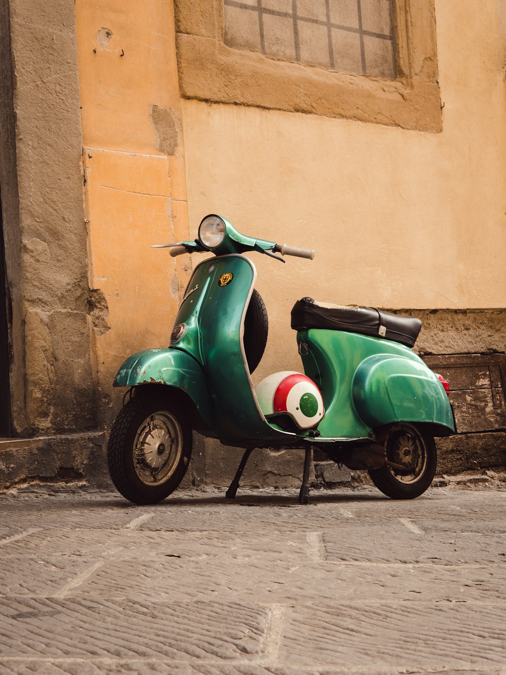 a green and white scooter