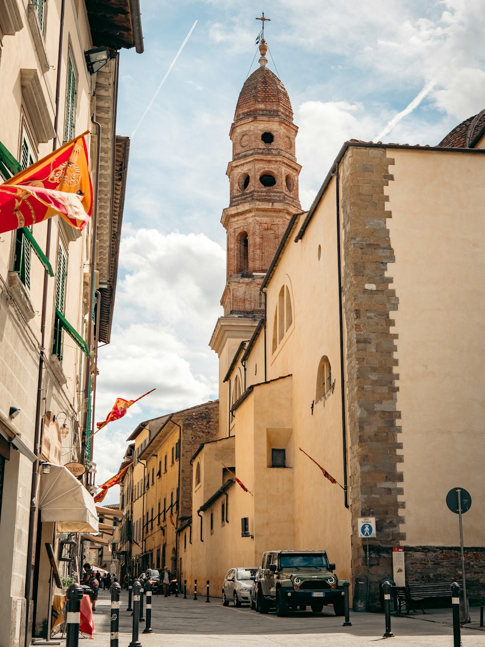 a street with cars and buildings on either side of it