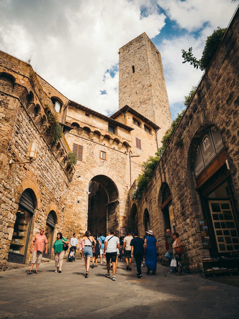 a group of people walking in front of a building