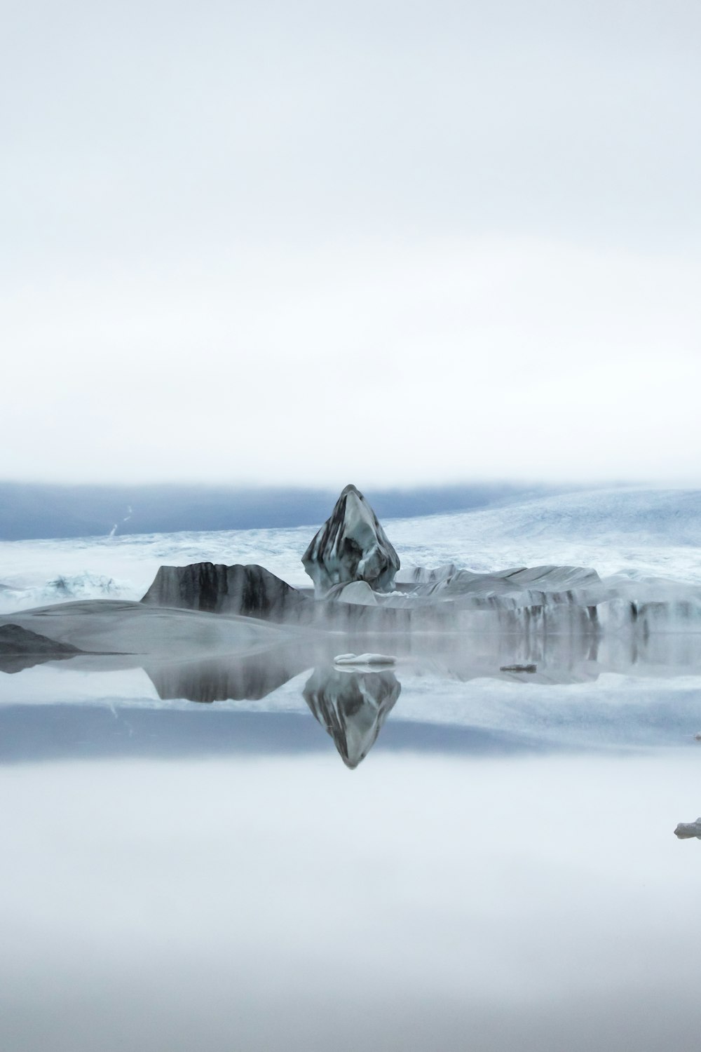 a group of icebergs in the water