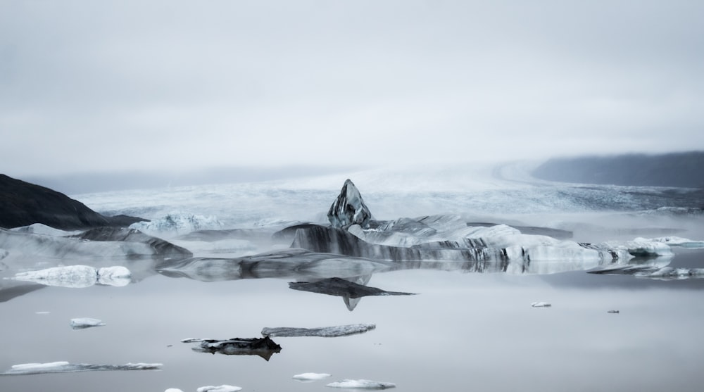 a group of icebergs in the water