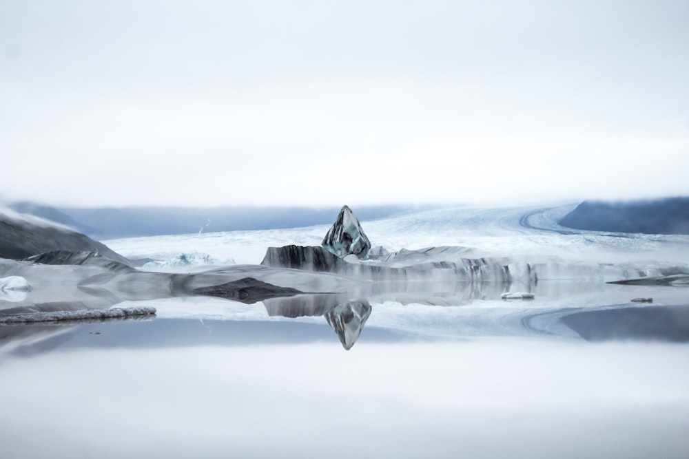 a group of icebergs in the water