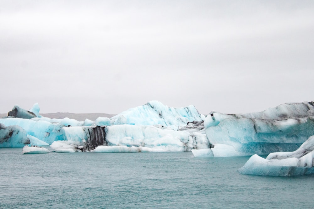 a group of icebergs in the water