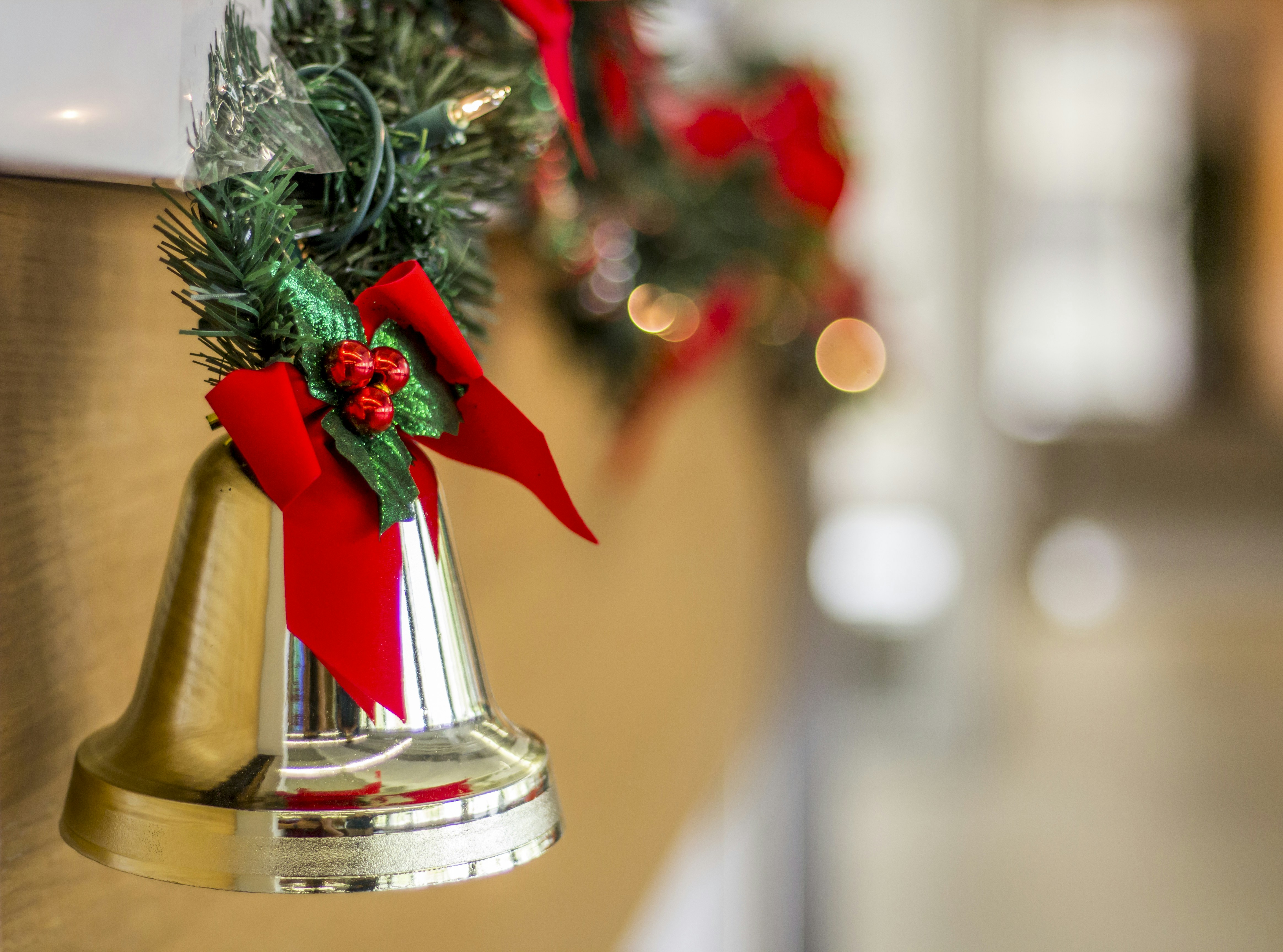 a small red vase with a red ribbon