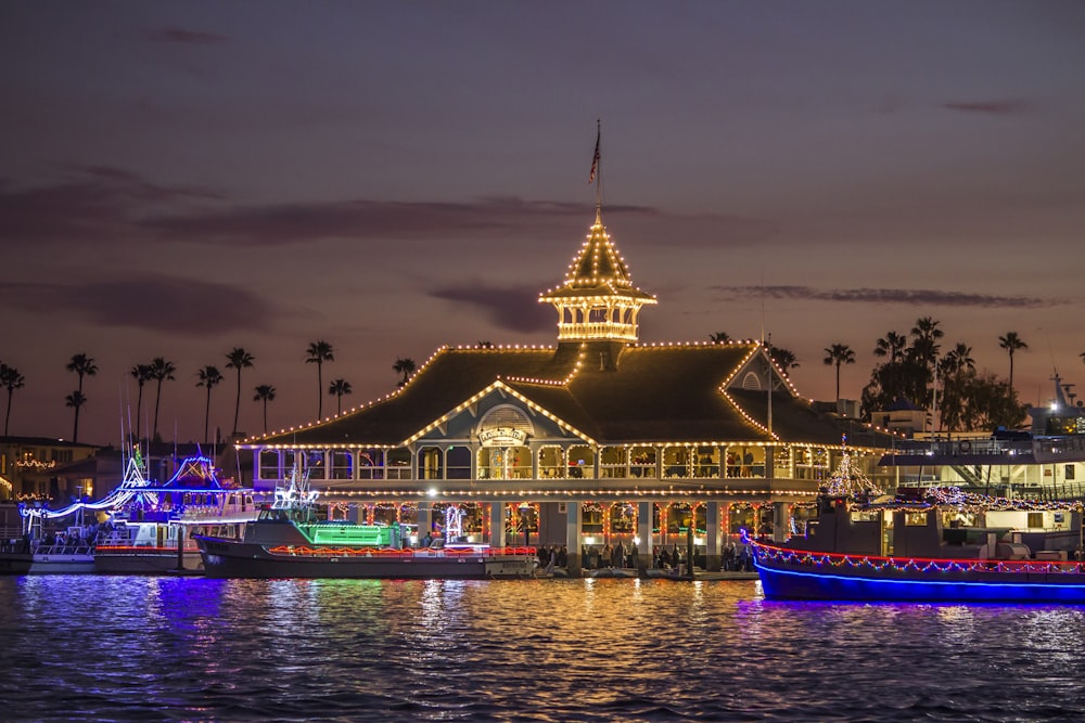 a building with a gold roof and a gold roof by water