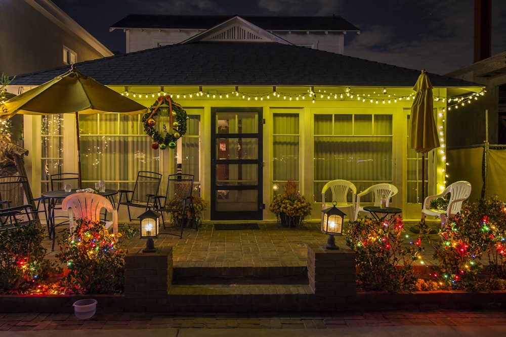 a house with a patio and tables and chairs