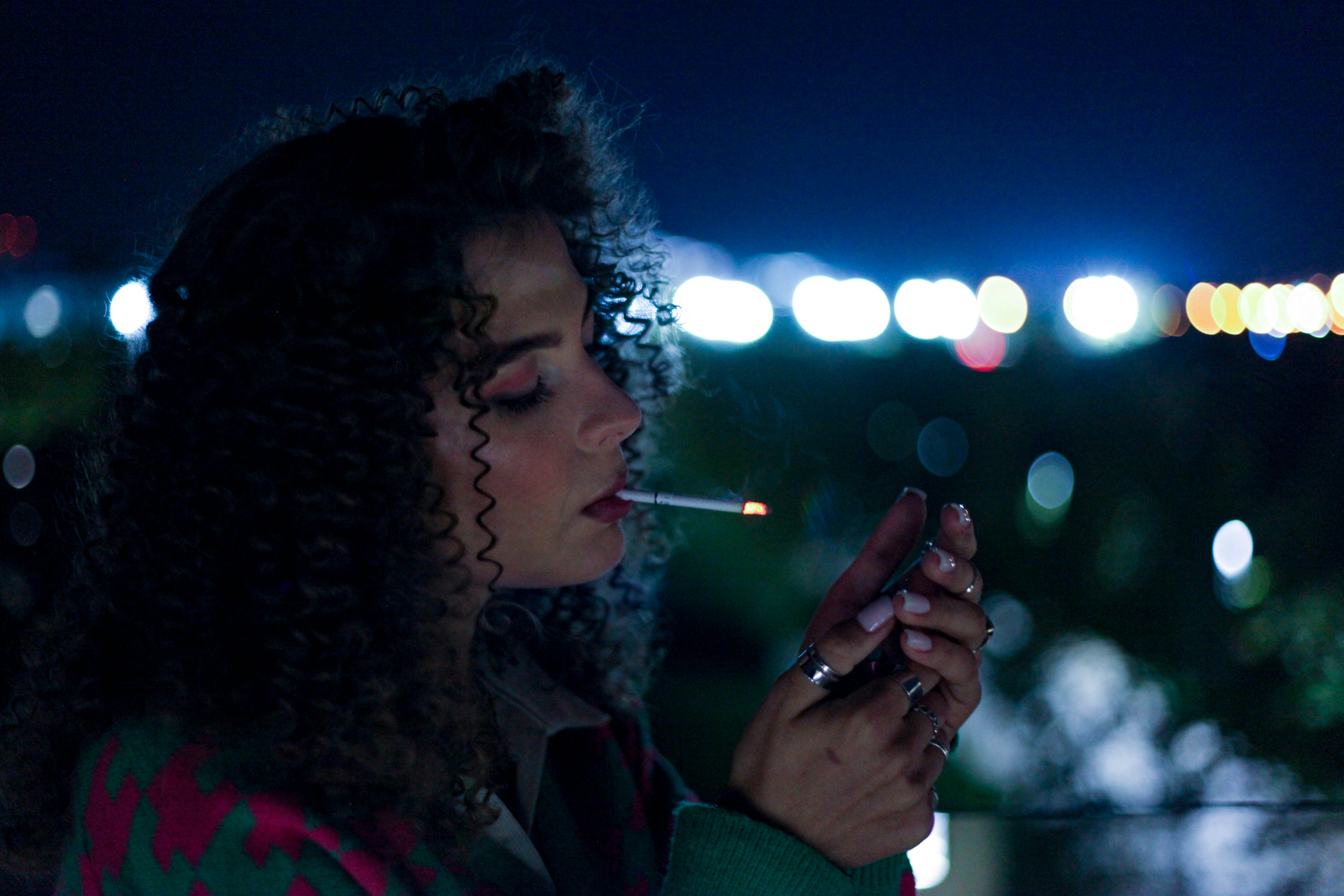 a person smoking a cigarette