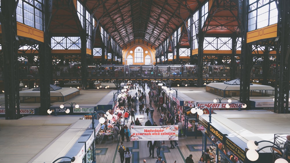 a large crowd of people in a large building