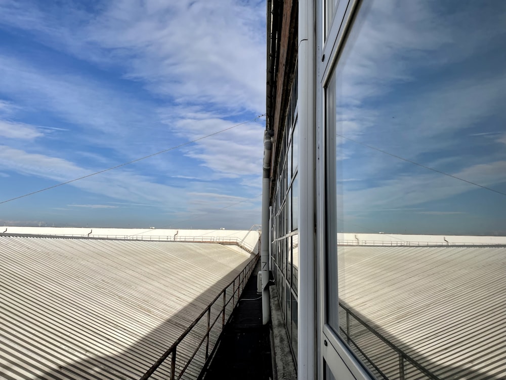 a view of the sky through a window of a building