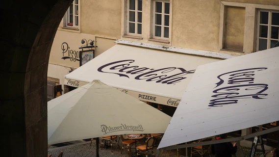 a white tent with a blue logo