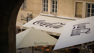 a white tent with a blue logo