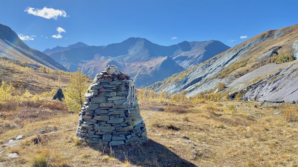 a stone structure in a valley