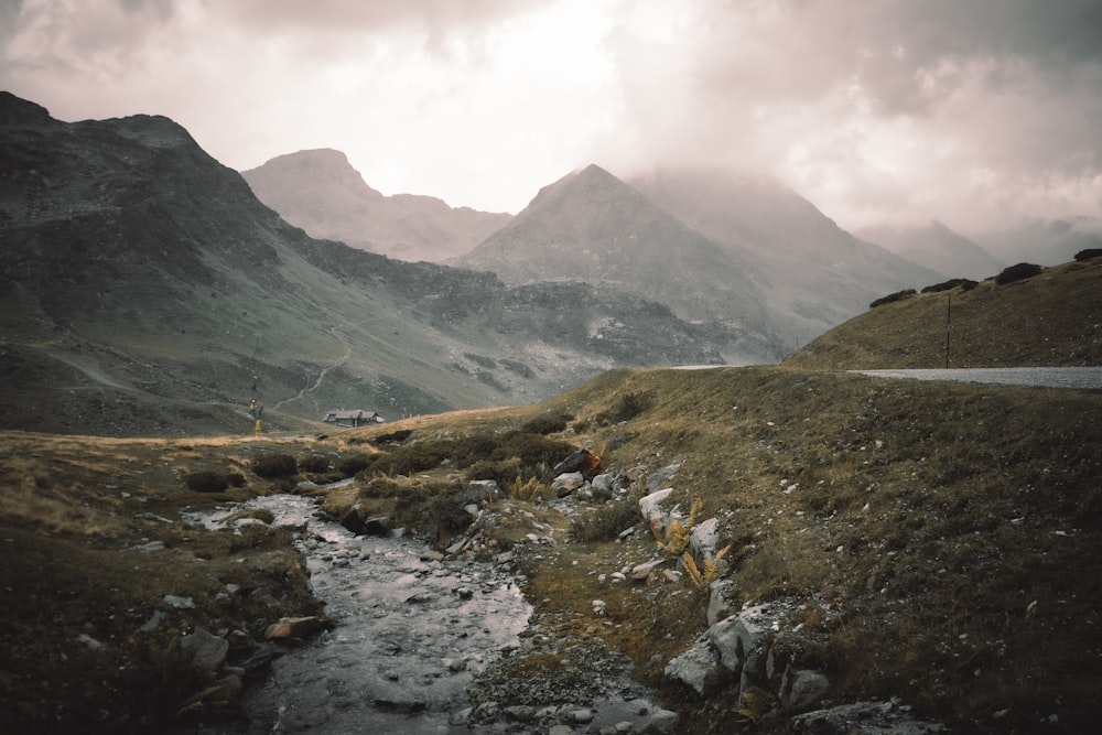 a rocky river running through a valley