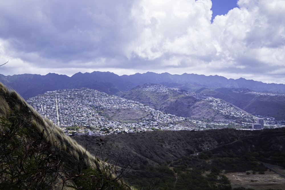 a landscape with mountains and clouds