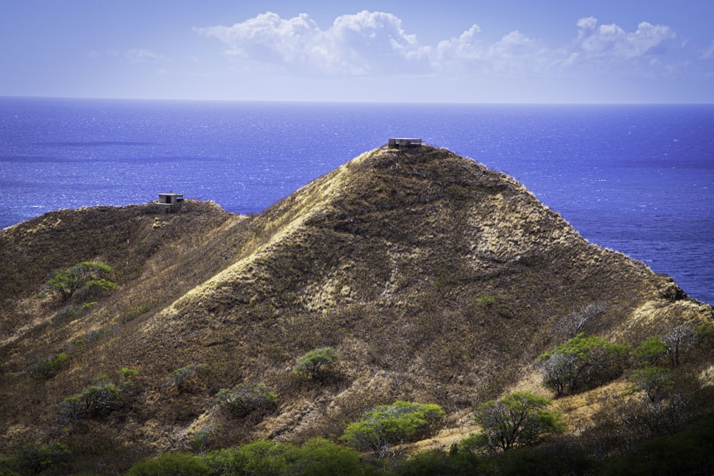 a building on a hill by the ocean