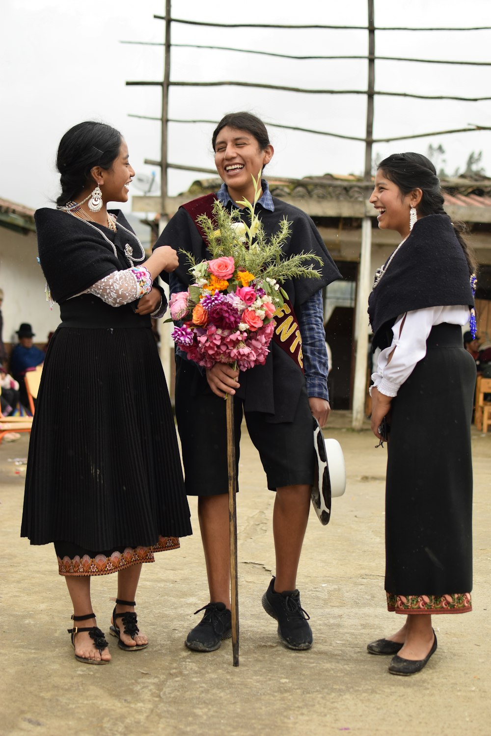 a person in a dress holding flowers