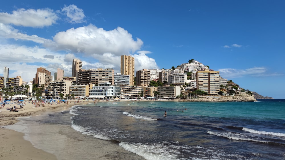 a beach with buildings along it