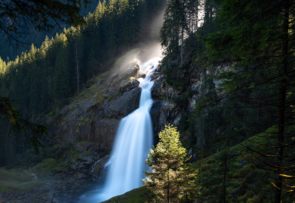 a waterfall in a forest