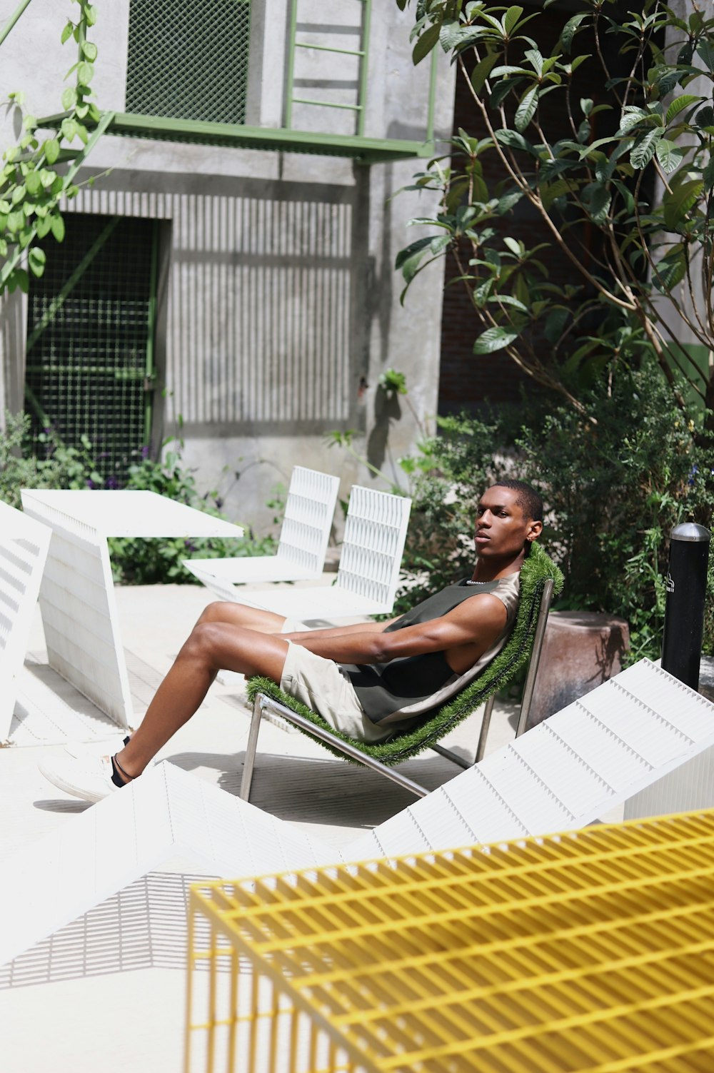 a person sitting on a chair outside